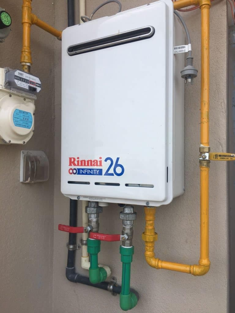 Rinnai gas water heater fitted to an apartment wall