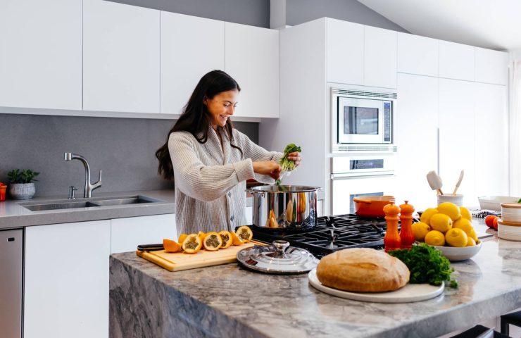 Woman cooking healthy meal at home